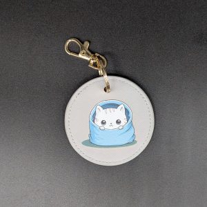 Porte clés simili - Rond gris - Chat caché